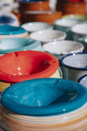 Beautiful decorative dishes for sale on the street in historic town In Pollentia, Alcudia, Spain.の写真素材