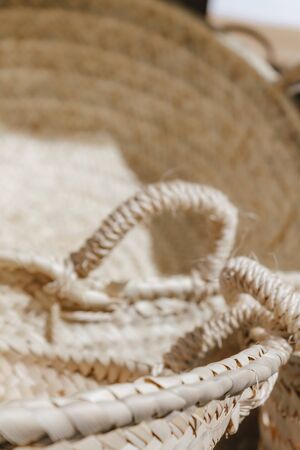 Handmade wicker baskets at a street fair. The concept of craft products, selling unique things, traditional culture. Ecological baskets not to consume plastic and go shoppingの写真素材