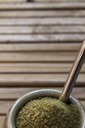 Mate Herbs Drink traditional from Argentina, Straw. With Calabash on wooden table.の写真素材