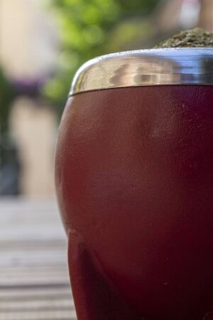 Mate Herbs Drink traditional from Argentina, Straw. With Calabash on wooden table.の写真素材