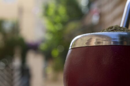 Mate Herbs Drink traditional from Argentina, Straw. With Calabash on wooden table.の写真素材