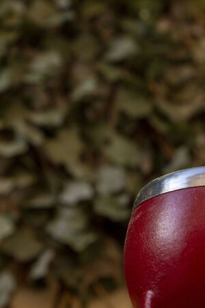 Mate Herbs Drink traditional from Argentina, Straw. With Calabash on wooden table.の写真素材