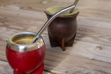 Mate Herbs Drink traditional from Argentina, Straw. With Calabash on wooden table.の写真素材