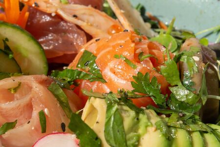 Macro of poke, raw fish served over rice or quinoa typical of Hawaii. Healthy and energizing dish...