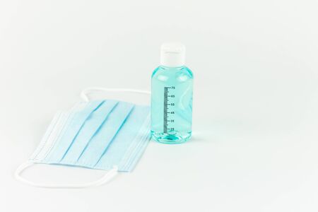 Sanitizing gel together with medical protection mask. Covid concept.の写真素材
