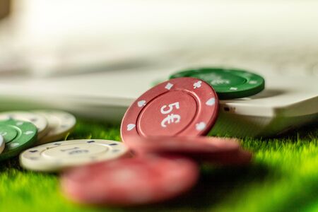Internet gambling services. Betting on the Internet and winning money with games of chance. Play poker at home.の写真素材
