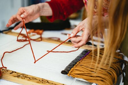 Woman demonstrating weaving and knottingの写真素材