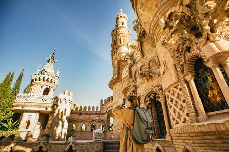 Backpacker photographing Castillo de Colomaresの写真素材