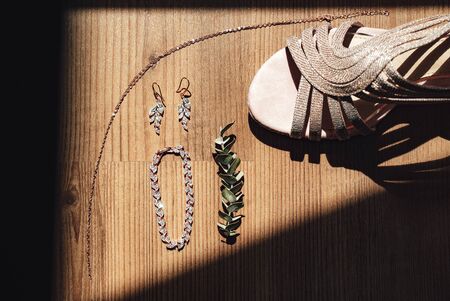 Gold chain, bracelet and earrings for a brideの写真素材