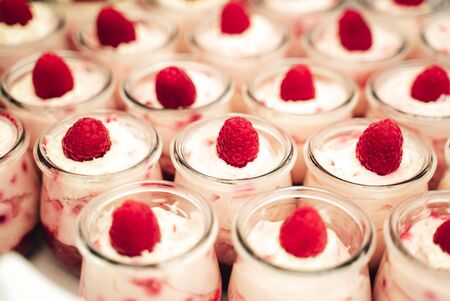 Individual cups of fruity mousse with cream