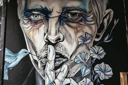Wall mural of a man making a shush gestureのeditorial素材