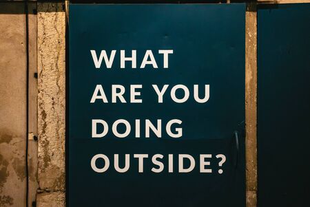 What Are You Doing Outside sign on a storeの写真素材