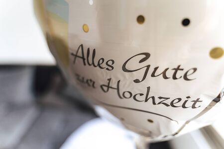Inflated plastic balloon with lettering "all the best for your wedding". Wedding day concept.の写真素材