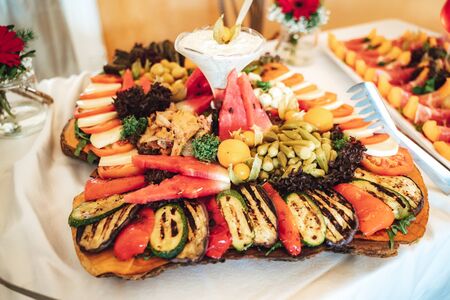 Vegetarian salad with various vegetables and fruits on buffet table. Celebration, party, birthday or wedding concept.の写真素材