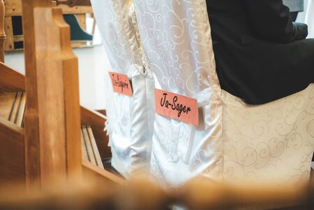 Closeup view of lettering on wedding couple chairs at wedding party. Ja-sager or Ja-sagerin means I said yes in male and female form. Wedding dayの写真素材