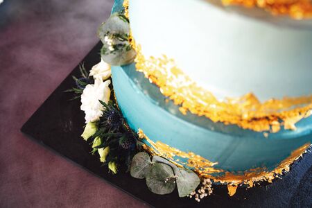 Top view of wedding cake floral decoration. Various flowers at cake base. Wedding day concept.の写真素材
