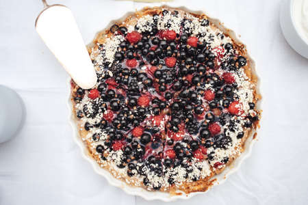 Close up top view of black fruit cheesecake tart served for guest at wedding partyの写真素材
