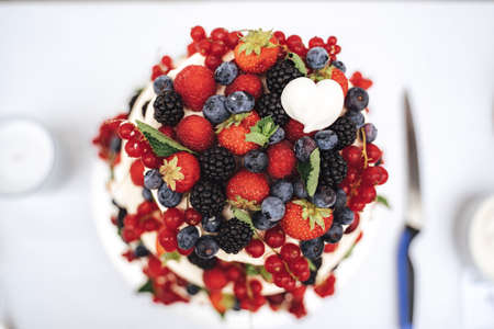 Top view close up of fruit wedding cake decorated with various berries at receptionの写真素材