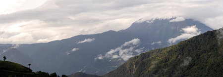 panorama of volcano in ecuador with clouds on topの写真素材