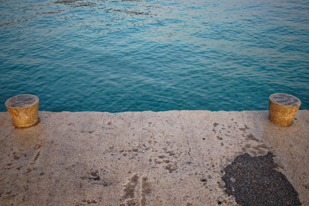 High angle view of an concrete pier with turquoise waterの写真素材