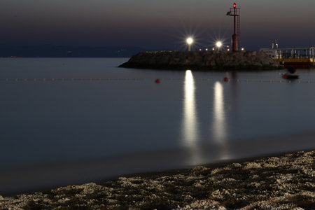View from beach on sea with iluminated lanternsの写真素材