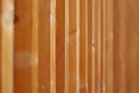 Closeup view of a wall made of wooden posts