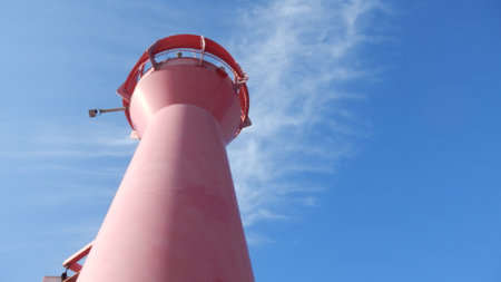 View of a pink sea lantern against a blue sky in Kolobrzeg on Baltic sea in Polandの写真素材
