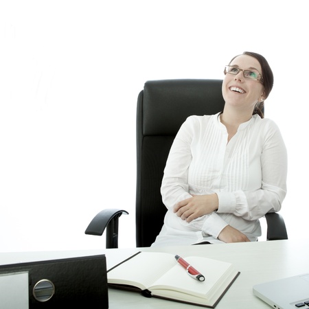 young brunette businesswoman with glasses is happyの写真素材