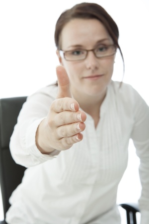 young brunette businesswoman with glasses give hand の写真素材