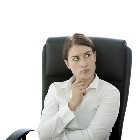 young beautiful woman think in chair ideaの写真素材