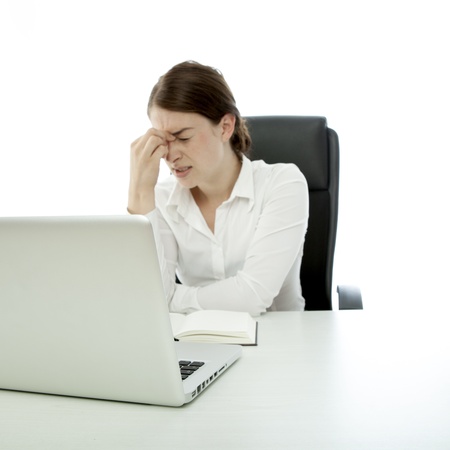 young brunette business woman headache touch head fingerの写真素材