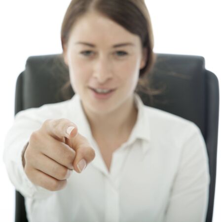 young brunette business woman want you signの写真素材