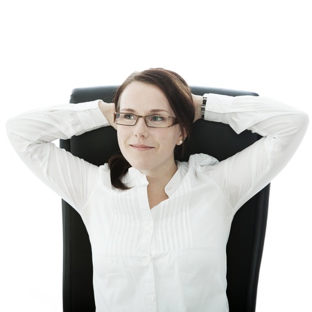 young brunette businesswoman with glasses is confident and smilingの写真素材