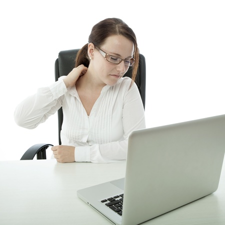 young brunette businesswoman with glasses has pain in neckの写真素材
