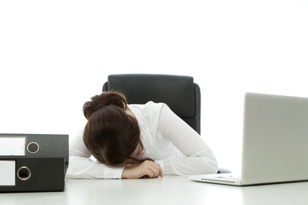 young brunette businesswoman with glasses fall asleepの写真素材