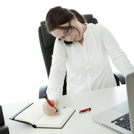 young brunette business woman with glasses is in trouble with workの写真素材