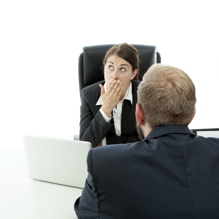 beard business man brunette woman at desk is bored while talkingの写真素材