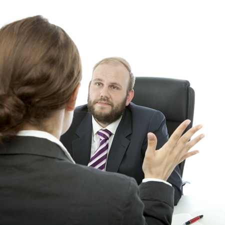 beard business man brunette woman at desk reportsの写真素材