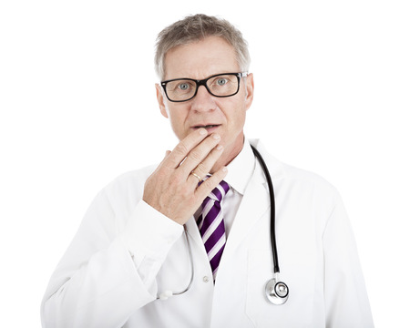 White Doctor in Glasses with Stethoscope on Shoulders Touching his Lip While in Doubt, Isolated on Whiteの写真素材
