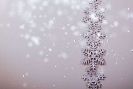 Christmas and New Years snowy snowflake backgroundの写真素材