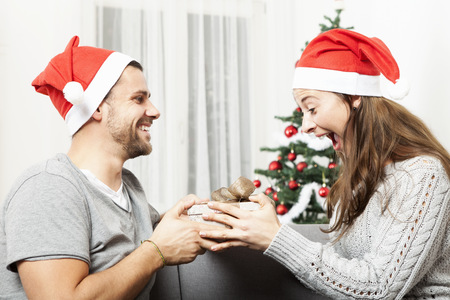 young girl is happy and excited about the gift of her boyfriendの写真素材