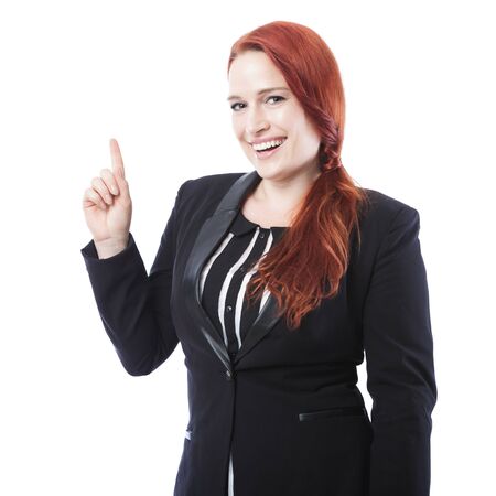 young beautiful business woman point up and smiles, isolated on white backgroundの写真素材