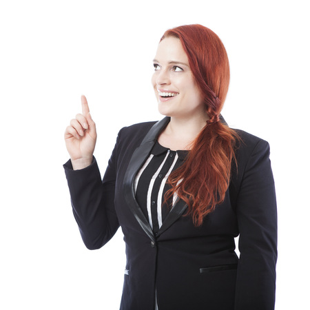 young beautiful business woman showing something above ,isolated on white backgroundの写真素材