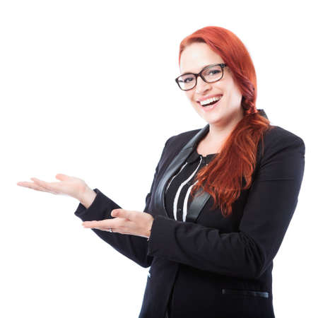 young beautiful business woman present something beside her, isolated on white backgroundの写真素材