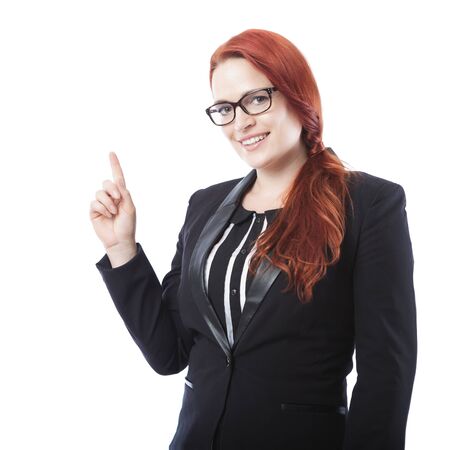 young beautiful business woman with glasses pointing something above ,isolated on white backgroundの写真素材