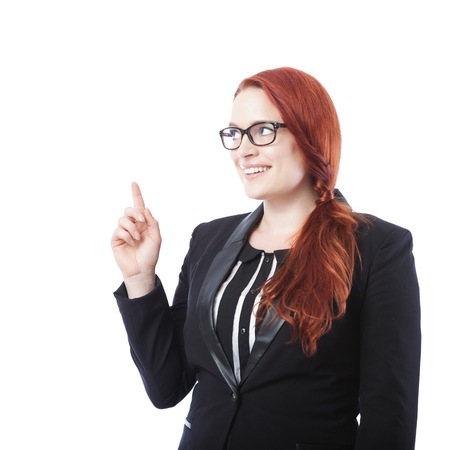 young beautiful business woman with glasses showing something above ,isolated on white backgroundの写真素材