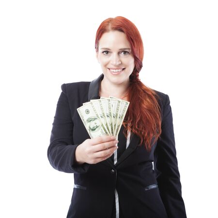 young beautiful business woman with a lot of dollar bank notes, isolated on white backgroundの写真素材
