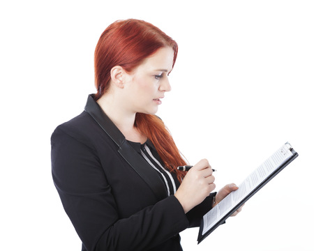 young beautiful business womanread dokument in her hand, isolated on white backgroundの写真素材