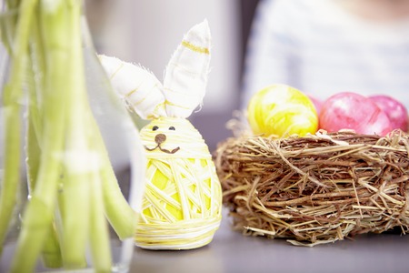 little easter bunny with eggs in basketの写真素材