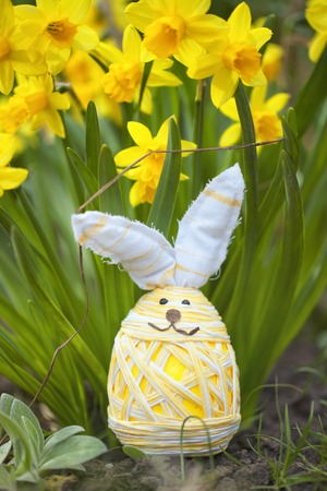 cute floral decoration with little  Easter egg outdoors in gardenの写真素材